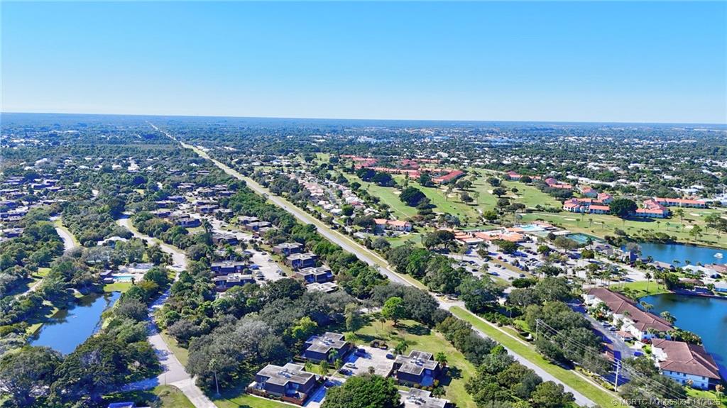 5111 Southeast Miles Grant Road, Unit 103 Stuart, FL 34997 - Photo 40 of 59 an aerial view of a city with lots of residential buildings