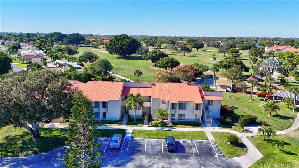 5111 Southeast Miles Grant Road, Unit 103 Stuart, FL 34997 - Photo 41 of 59 an aerial view of residential houses with outdoor space and swimming pool