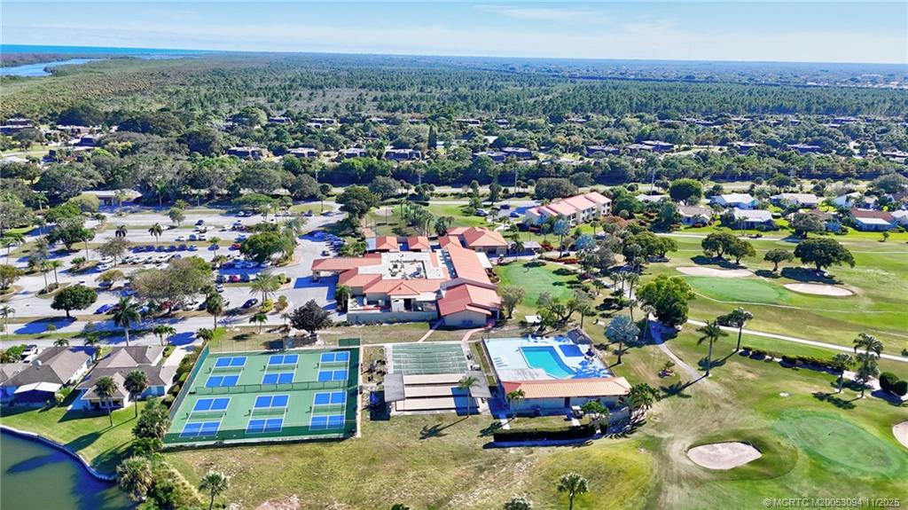 5111 Southeast Miles Grant Road, Unit 103 Stuart, FL 34997 - Photo 55 of 59 an aerial view of residential houses with outdoor space