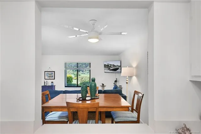 a kitchen with a sink a refrigerator and cabinets