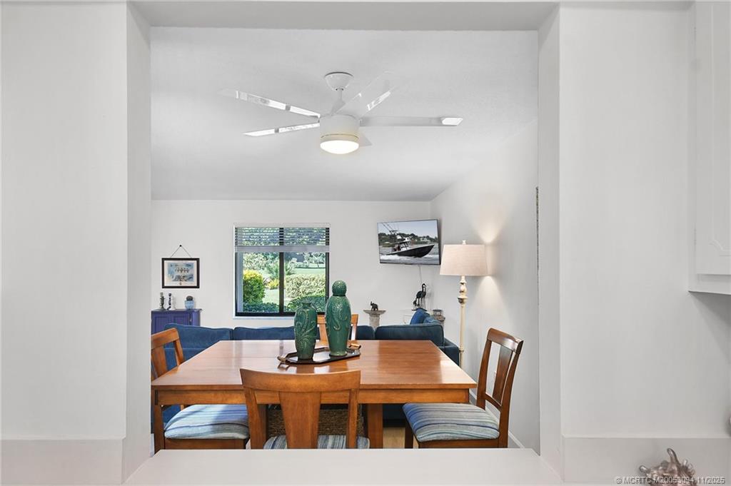 5111 Southeast Miles Grant Road, Unit 103 Stuart, FL 34997 - Photo 7 of 59 a view of a dining room with furniture and window