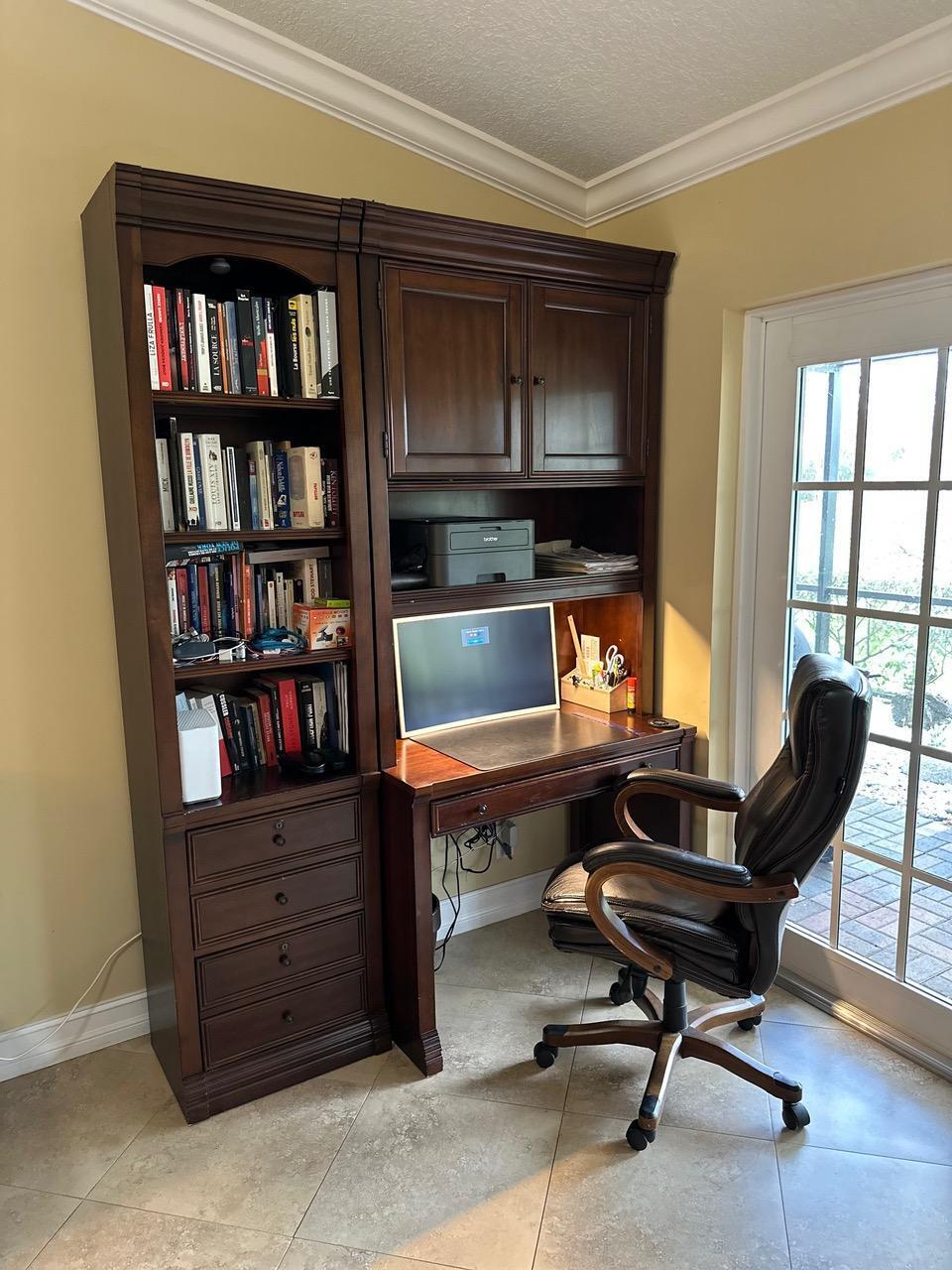 6594 Casabella Lane Boca Raton, FL 33433 - Photo 26 of 28 a living room with furniture and a bookshelf