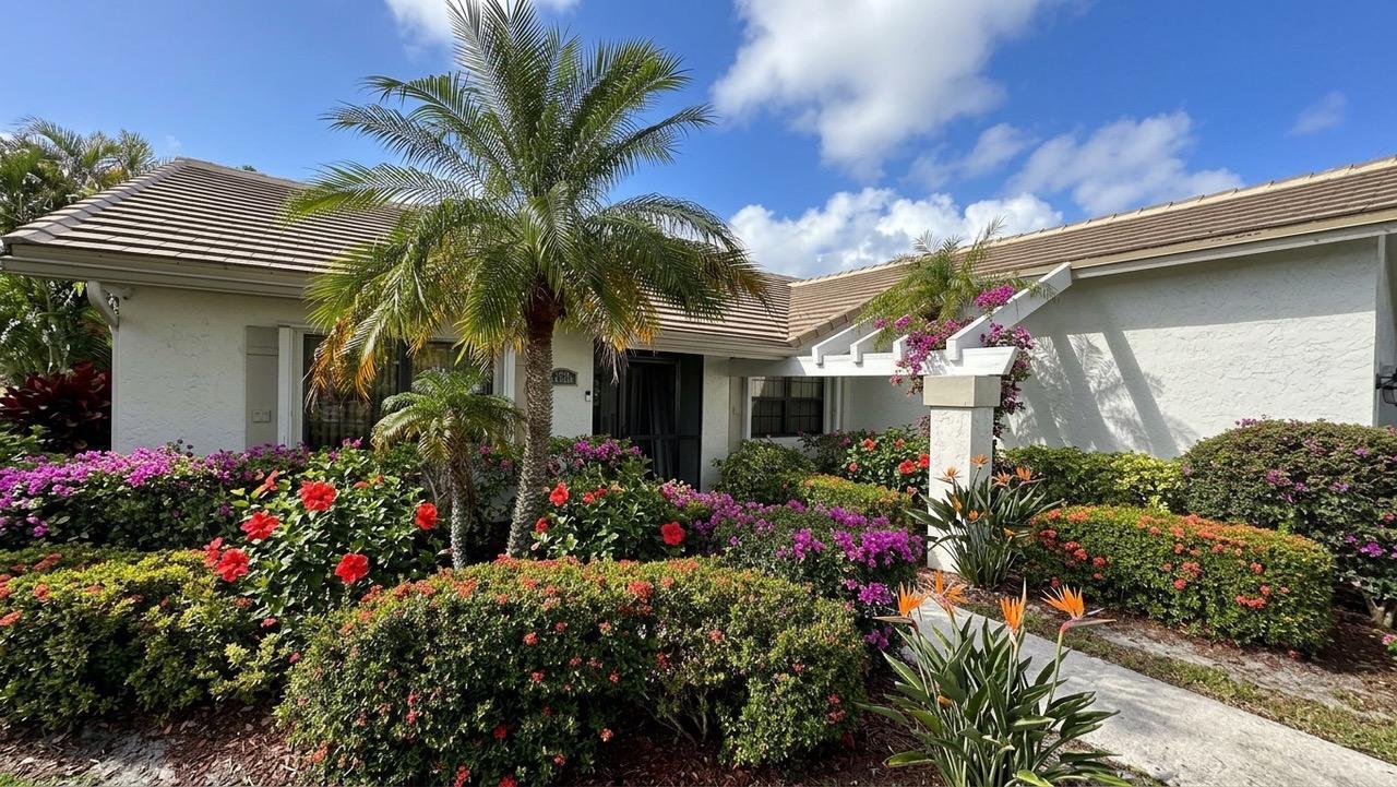 6594 Casabella Lane Boca Raton, FL 33433 - Photo 3 of 28 a view of a house with a flower garden