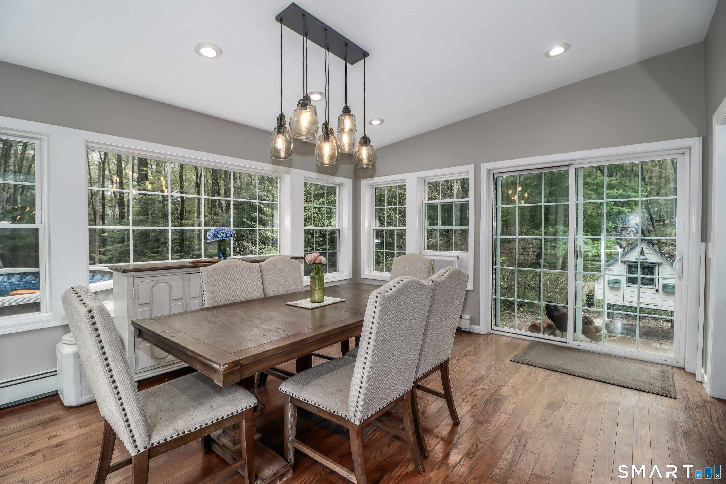 20 Puritan Valley Road Brookfield, CT 06804 - Photo 7 of 35 a view of a dining room with furniture wooden floor and chandelier