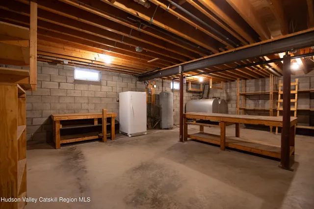 a view of empty room with wooden ceiling