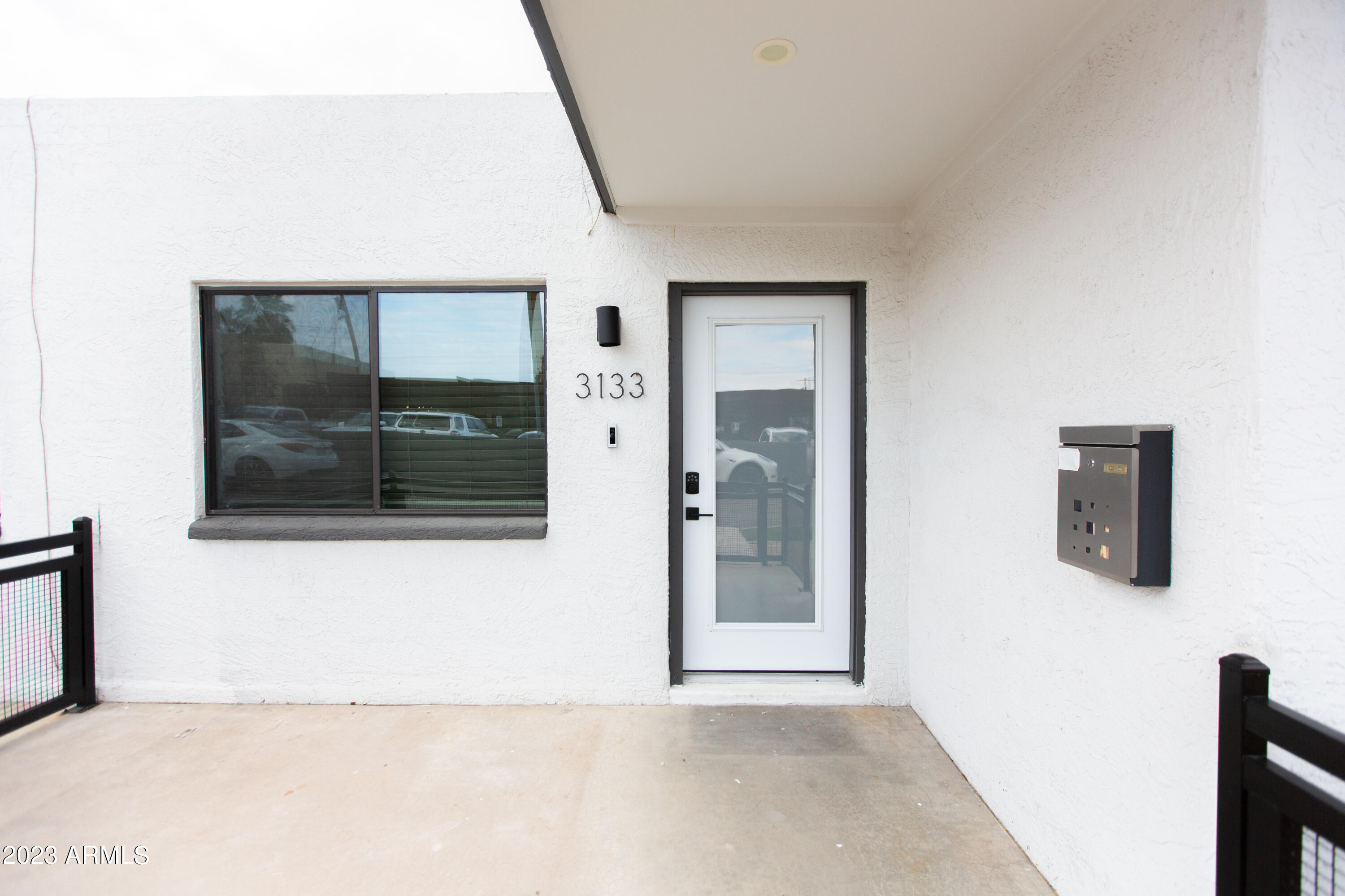 3133 East Fairmount Avenue Phoenix, AZ 85016 - Photo 11 of 11 a view of a hallway with wooden floor and a bathroom
