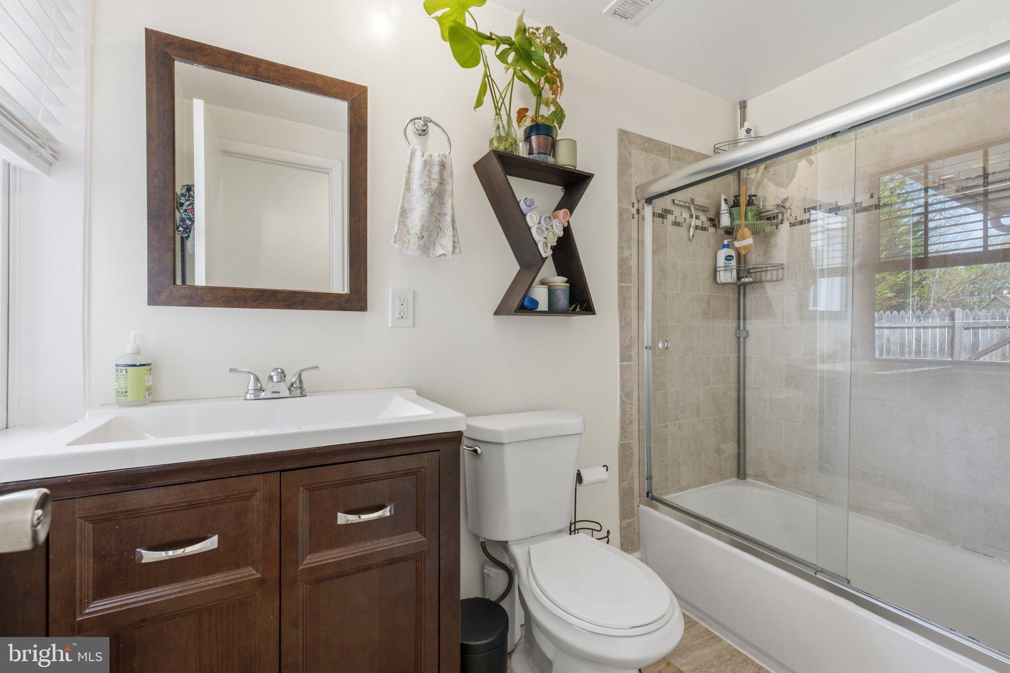 465 West South Street Frederick, MD 21701 - Photo 12 of 34 a bathroom with a sink a toilet and shower