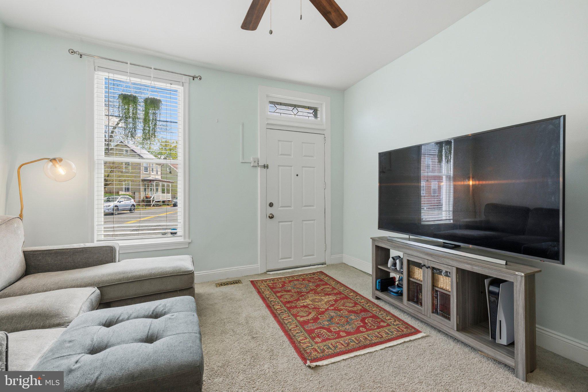 465 West South Street Frederick, MD 21701 - Photo 15 of 34 a living room with furniture and a flat screen tv