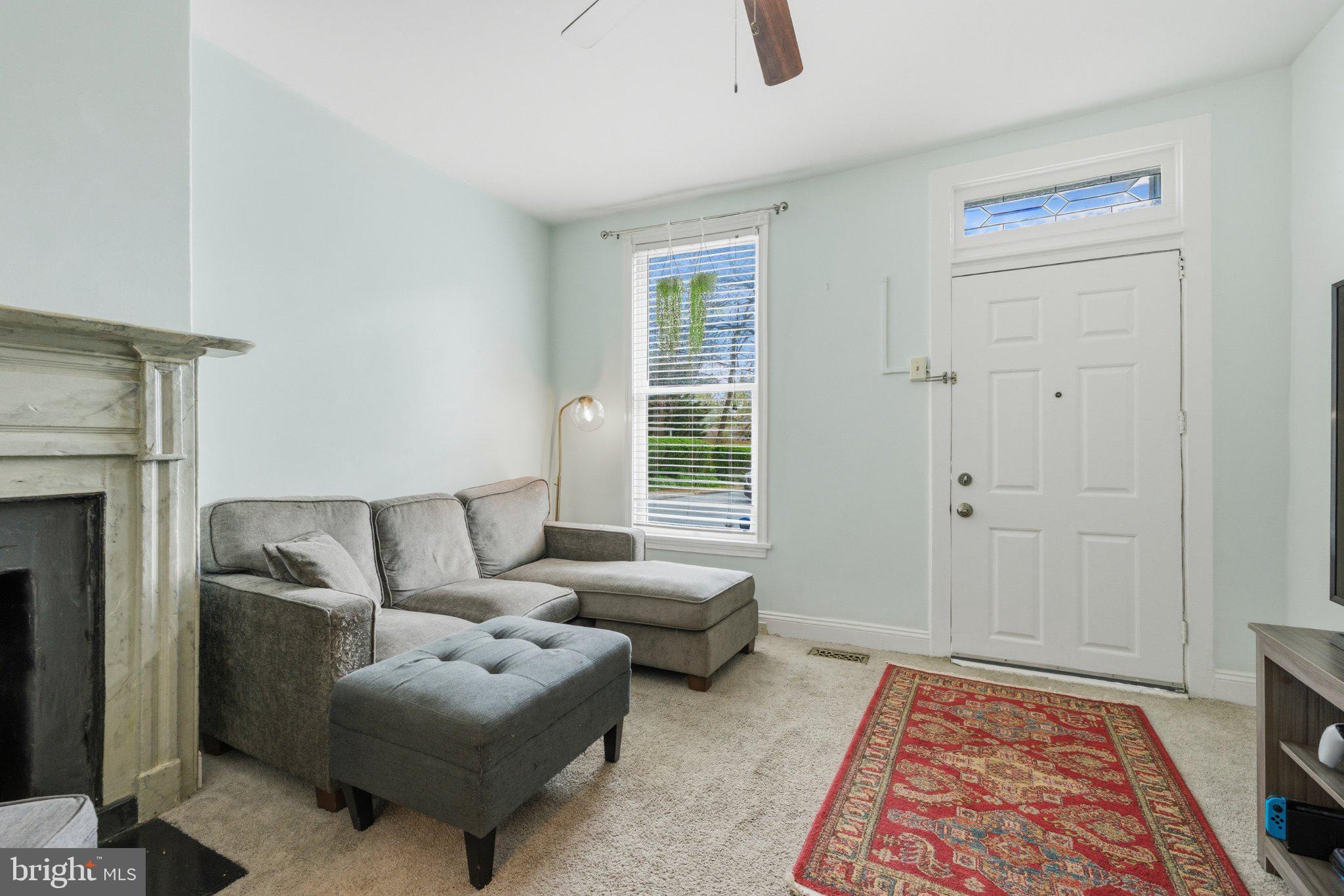 465 West South Street Frederick, MD 21701 - Photo 16 of 34 a living room with furniture and a rug