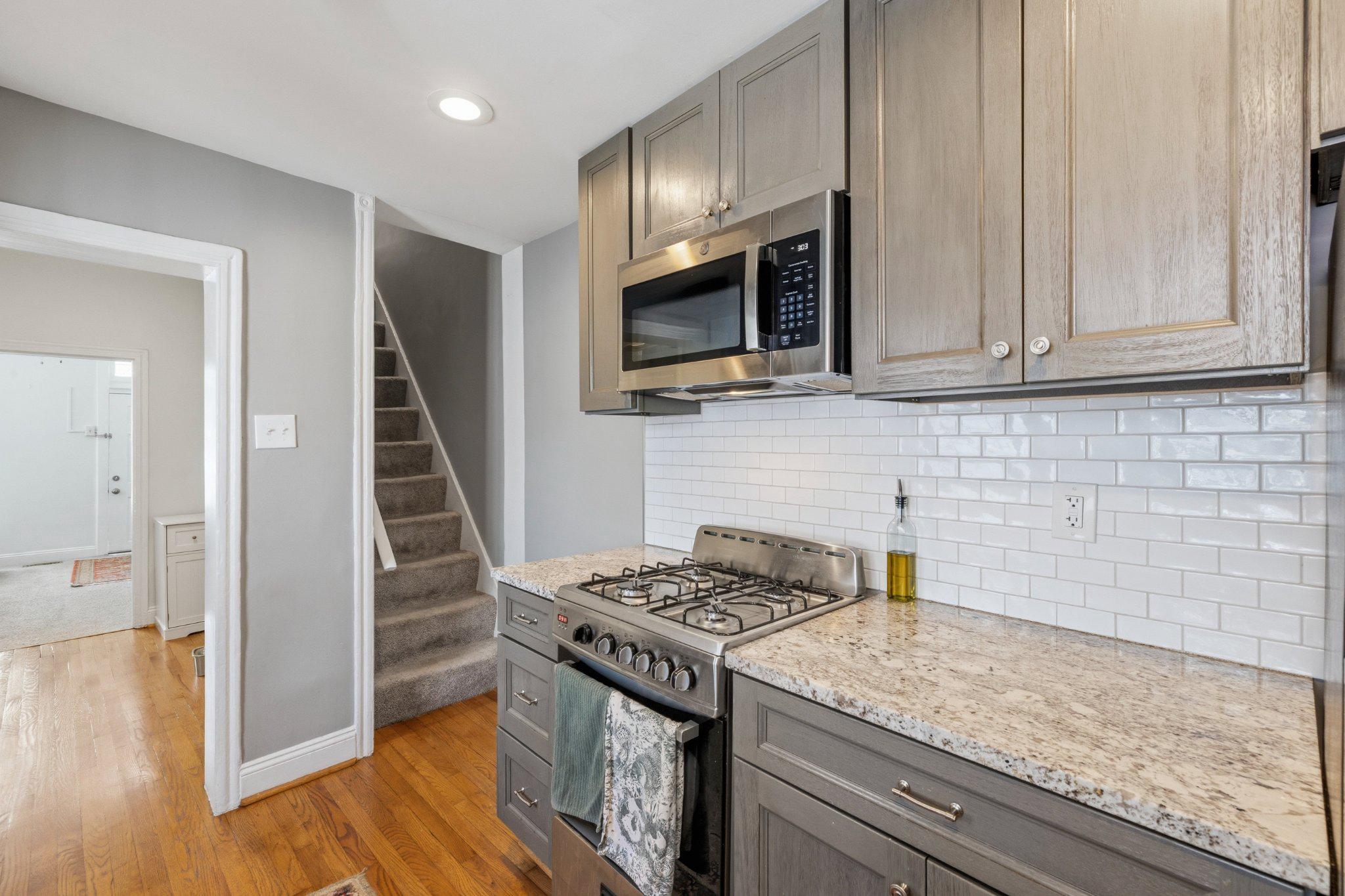 465 West South Street Frederick, MD 21701 - Photo 10 of 34 a kitchen with a stove and a microwave