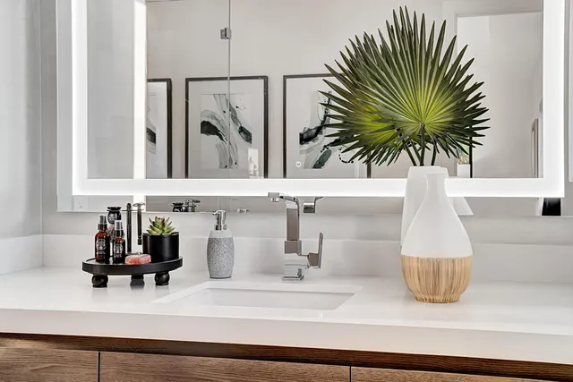 a bathroom with a sink and a mirror