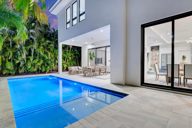 a view of swimming pool with outdoor seating