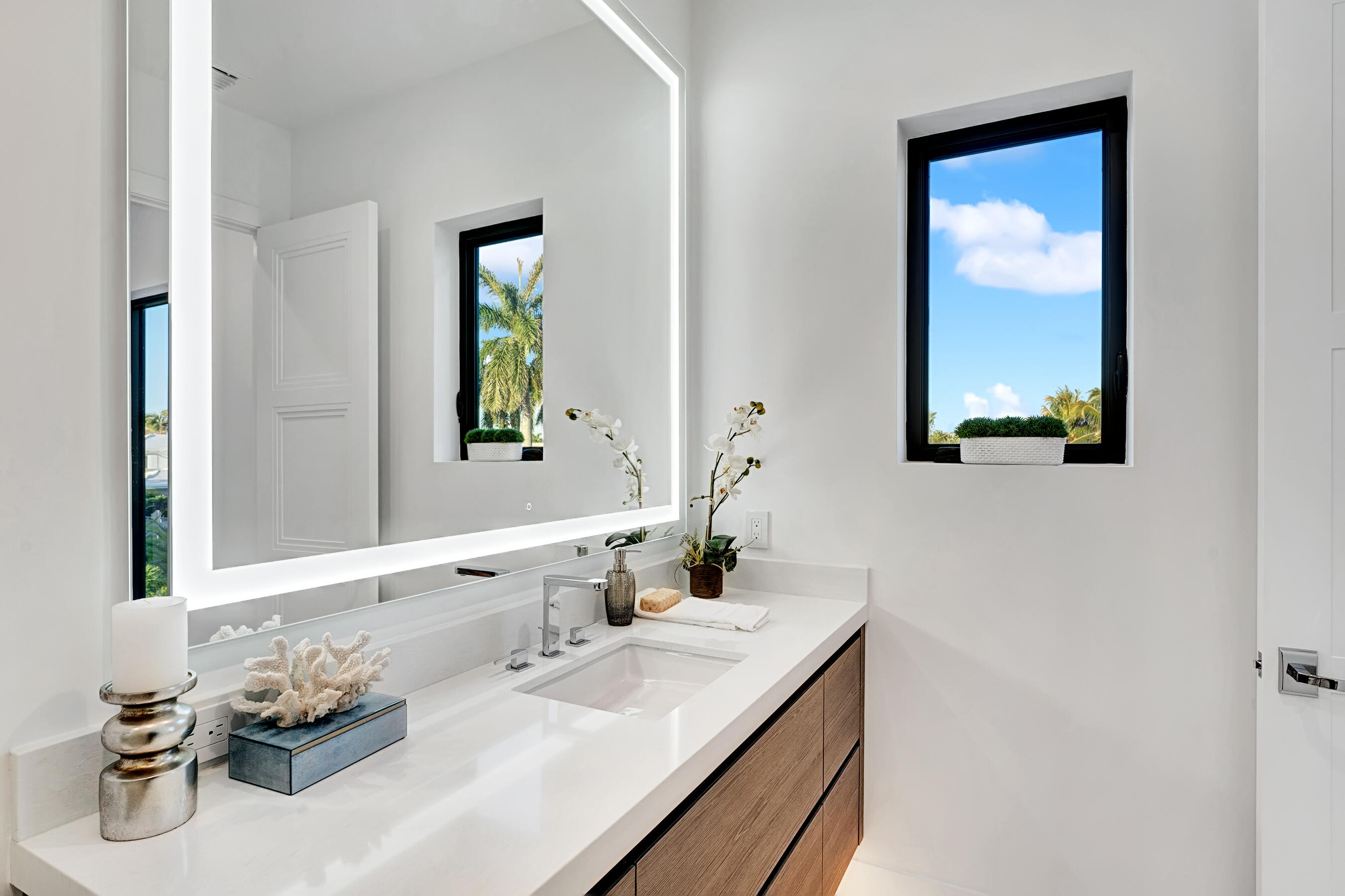 1133 Northeast 3rd Avenue Boca Raton, FL 33432 - Photo 24 of 38 a bathroom with a granite countertop sink and a mirror