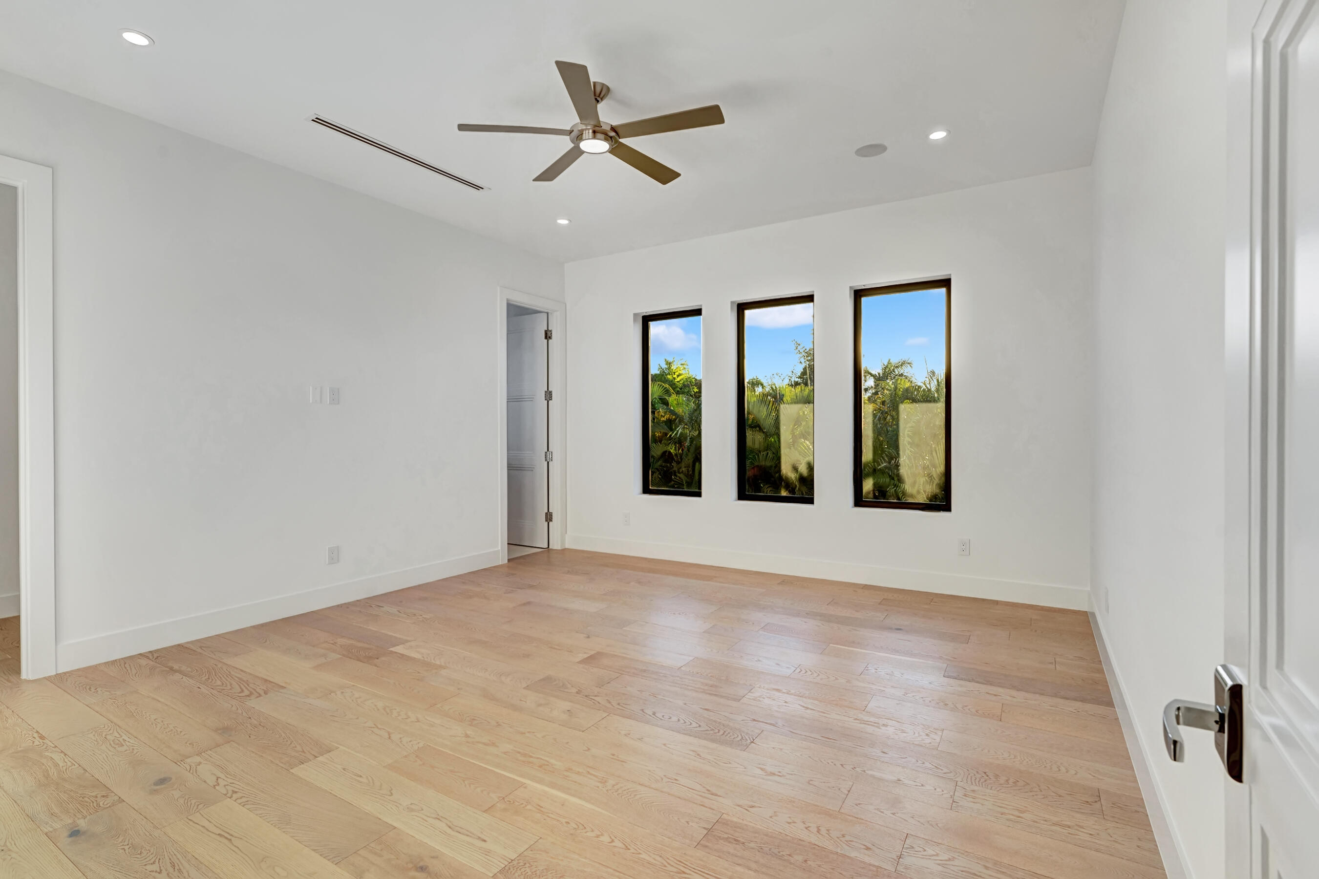 1133 Northeast 3rd Avenue Boca Raton, FL 33432 - Photo 26 of 38 an empty room with ceiling fan and windows