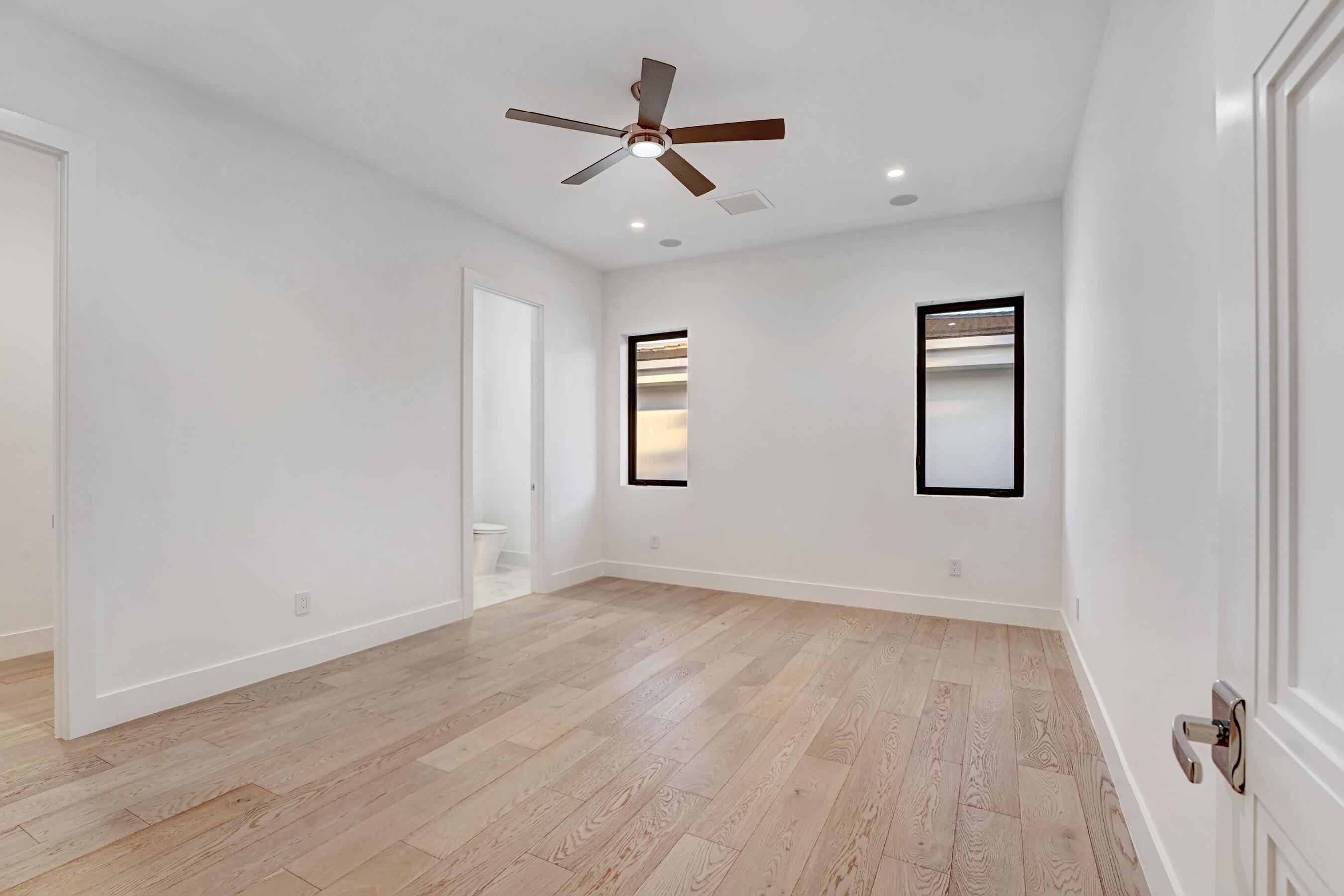 1133 Northeast 3rd Avenue Boca Raton, FL 33432 - Photo 27 of 38 wooden floor in an empty room with a window
