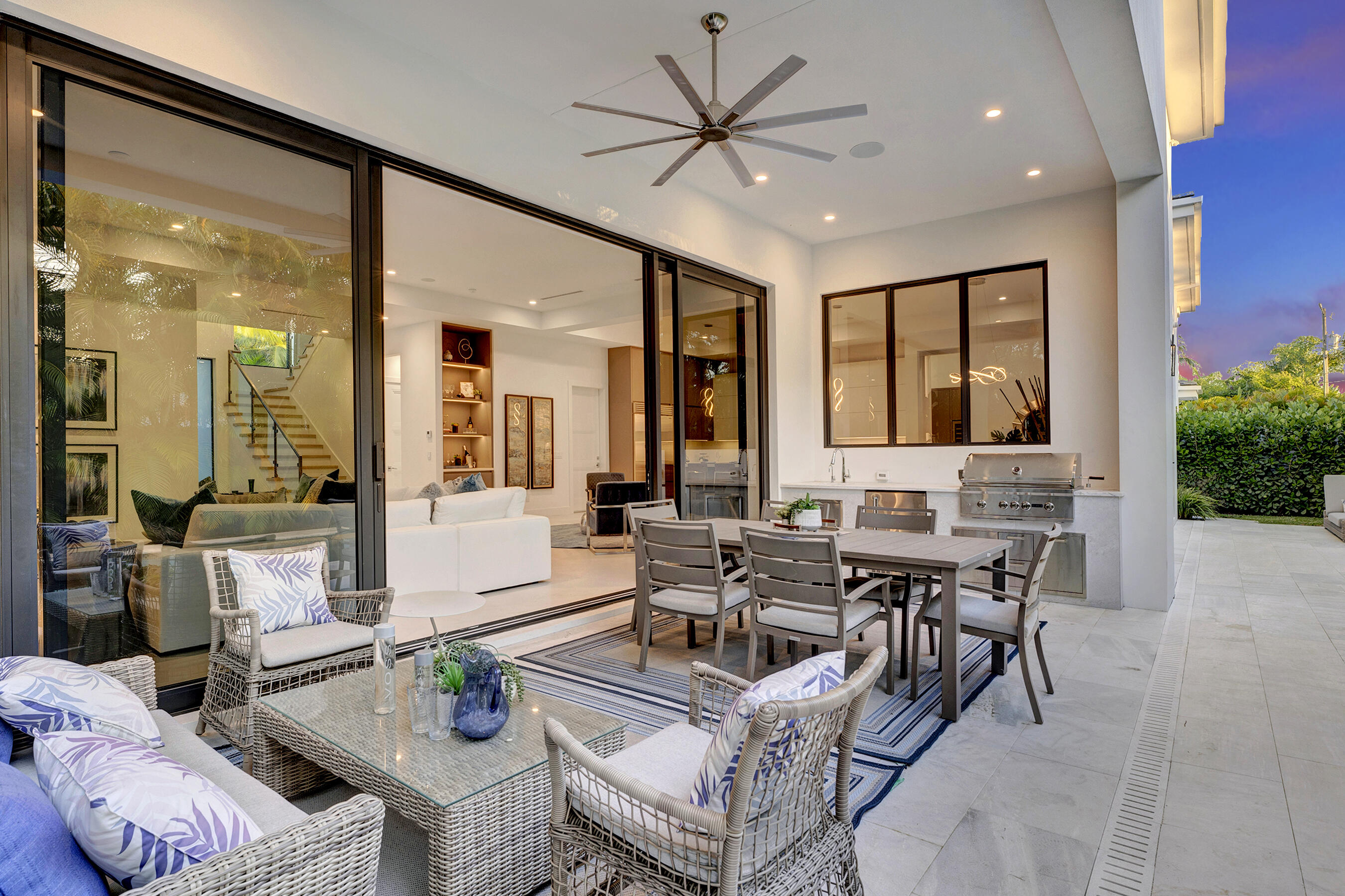 1133 Northeast 3rd Avenue Boca Raton, FL 33432 - Photo 29 of 38 a living room with furniture a large window and a chandelier