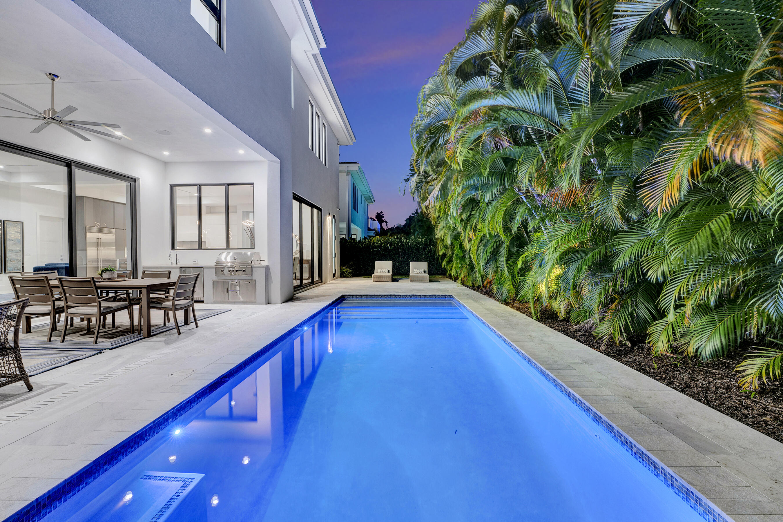 1133 Northeast 3rd Avenue Boca Raton, FL 33432 - Photo 32 of 38 a swimming pool with chairs