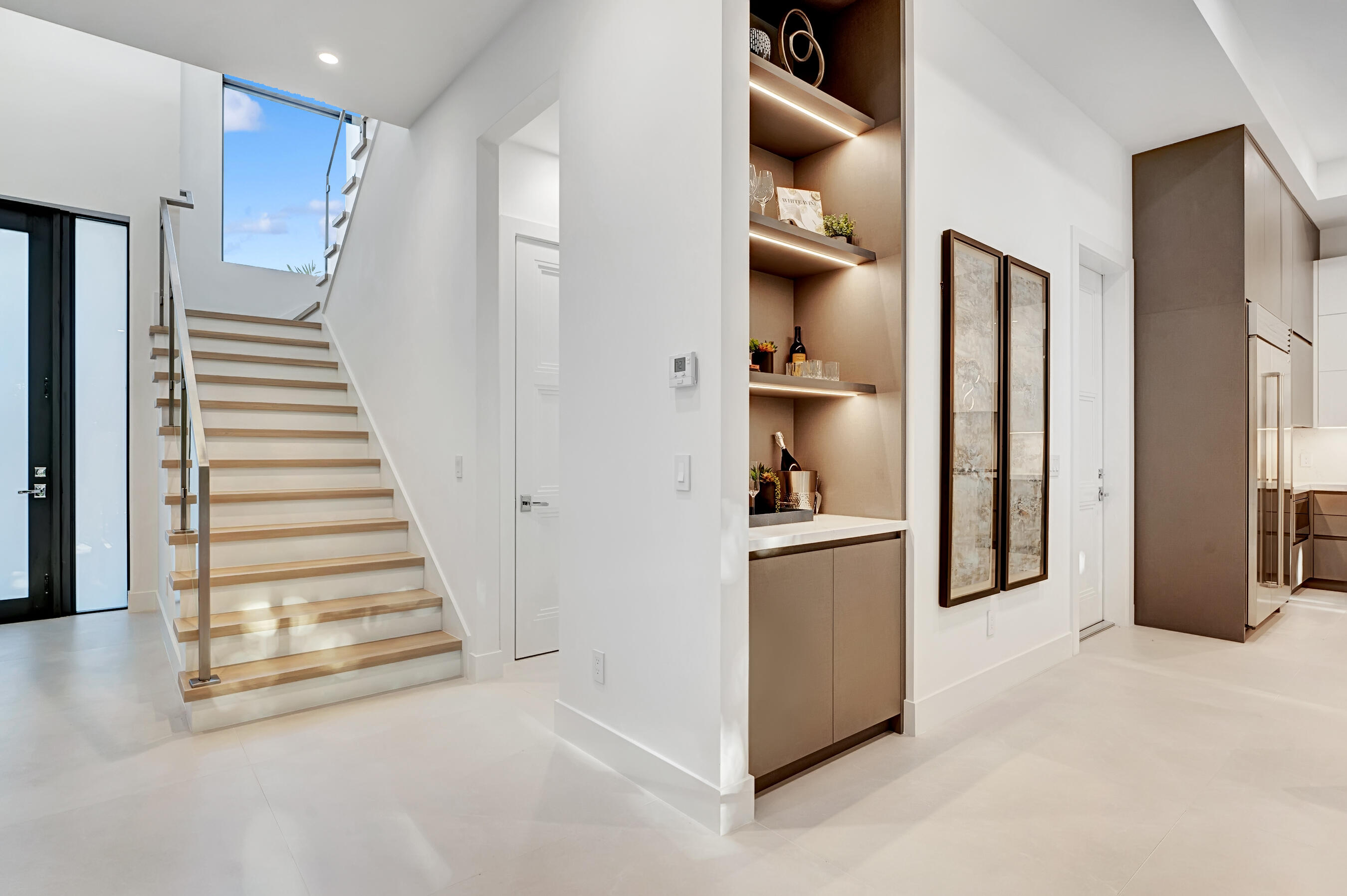 1133 Northeast 3rd Avenue Boca Raton, FL 33432 - Photo 4 of 38 a view of a kitchen with a refrigerator and cabinets