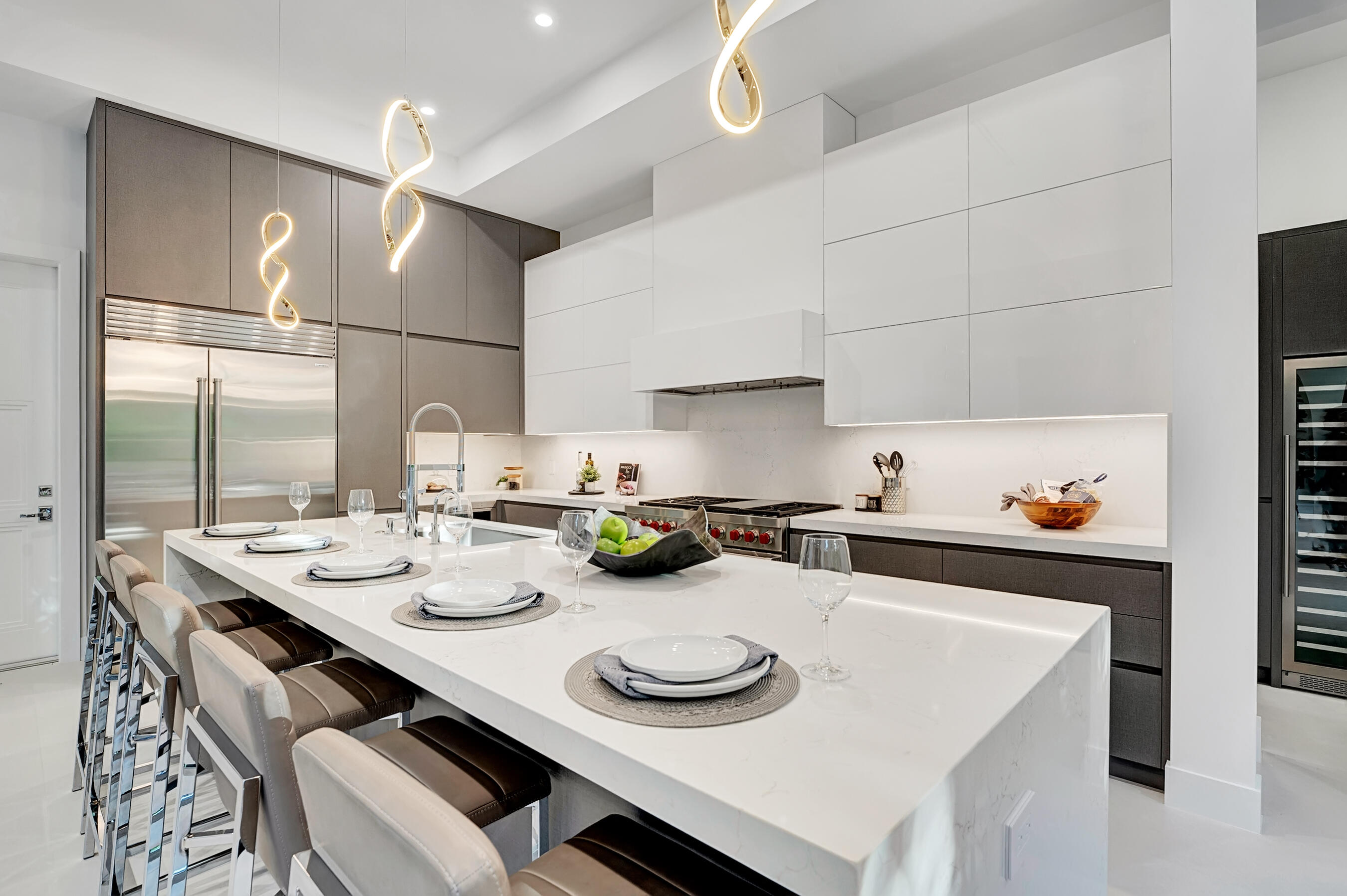 1133 Northeast 3rd Avenue Boca Raton, FL 33432 - Photo 8 of 38 a kitchen with a sink a stove and white cabinets