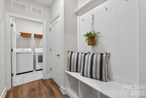 a view of entryway with wooden floor