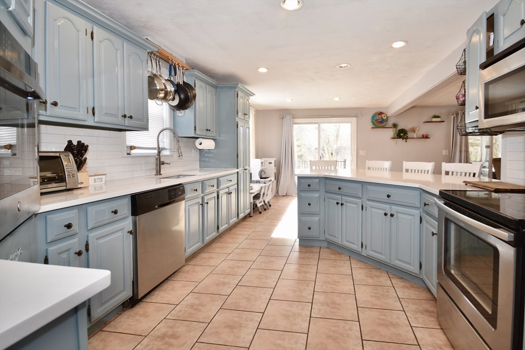 32 Gault Road Wareham, MA 02576 - Photo 3 of 23 a large kitchen with stainless steel appliances lots of counter space sink and a window