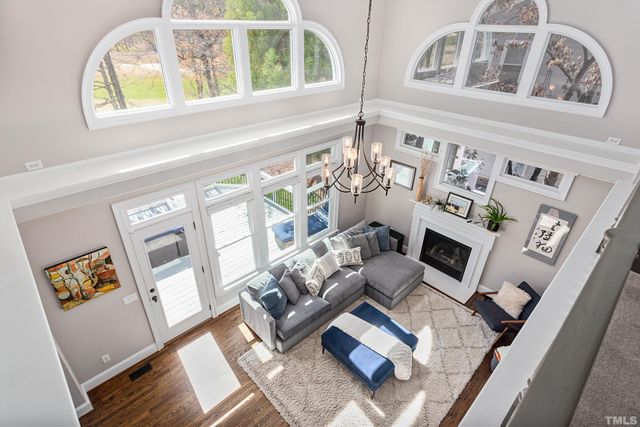 a bedroom with a large bed and a large window