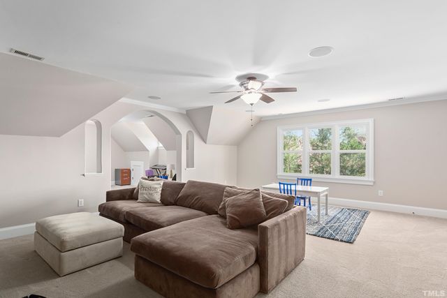 a view of a swimming pool with a patio and a yard