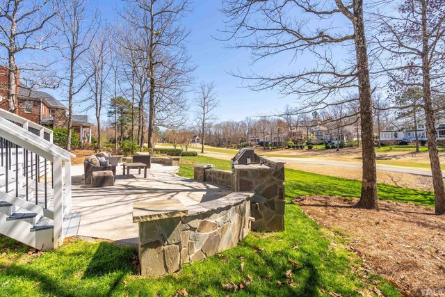 a view of a lake with couches and city view