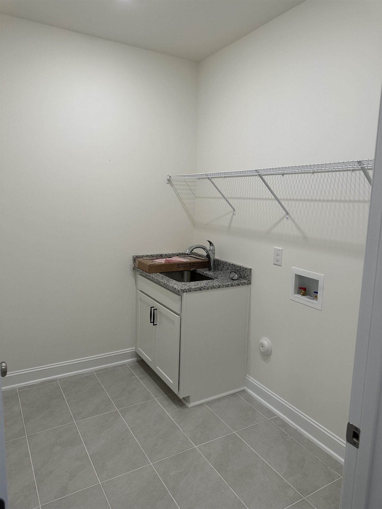 4432 Beckel Road Willow Spring, NC 27592 - Photo 7 of 22 a utility room with cabinets