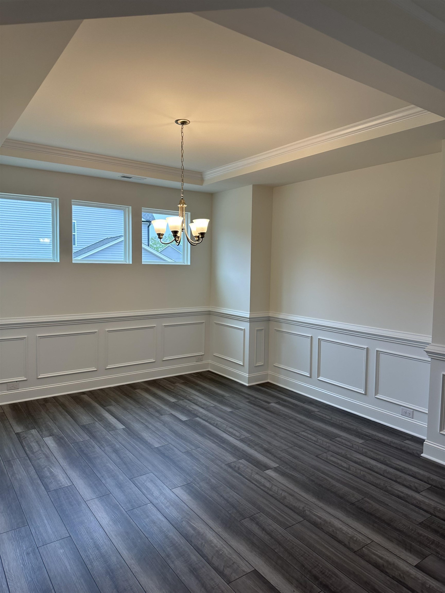4432 Beckel Road Willow Spring, NC 27592 - Photo 8 of 22 a view of an empty room with wooden floor and a window