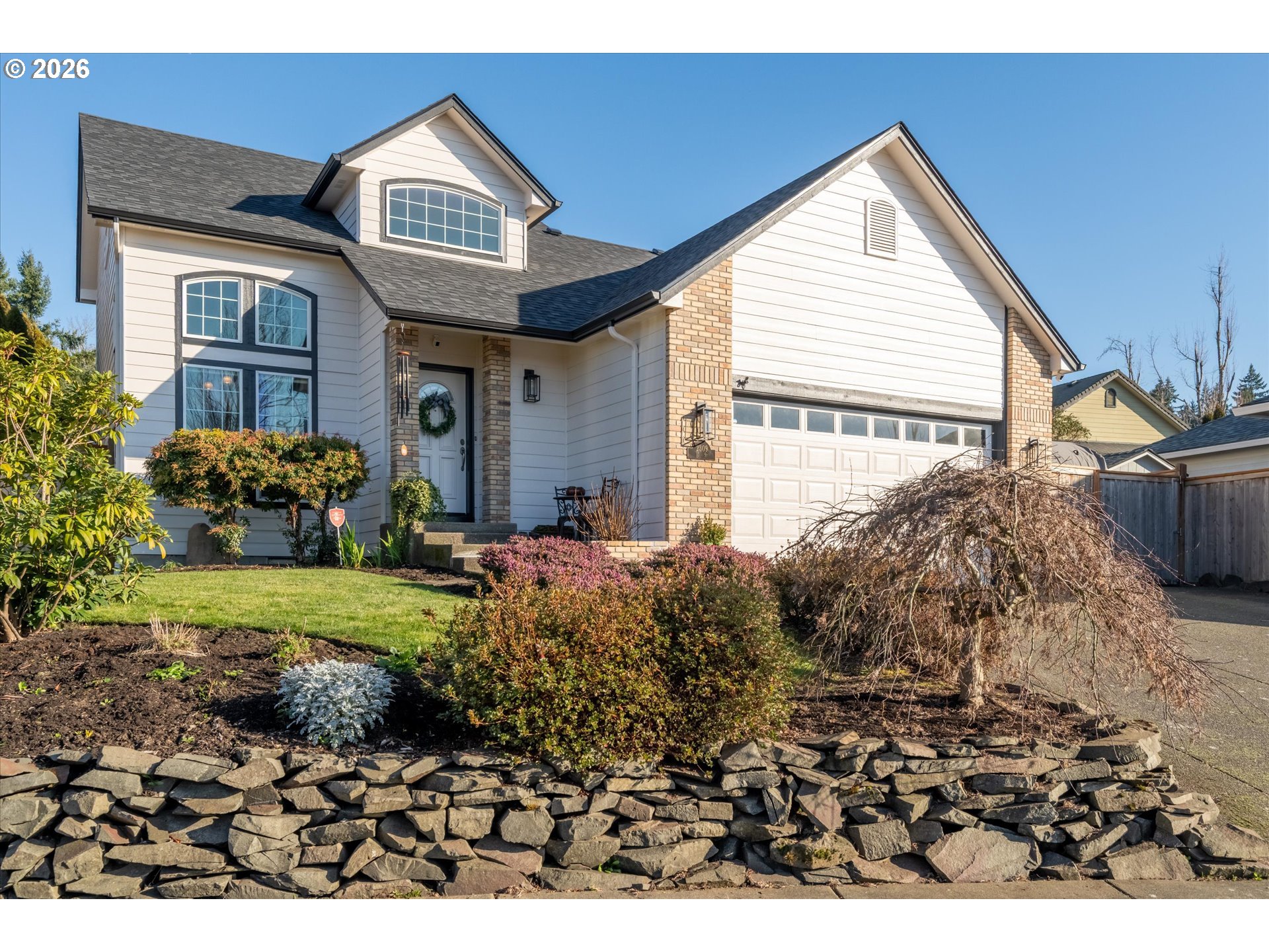 a front view of a house with garden