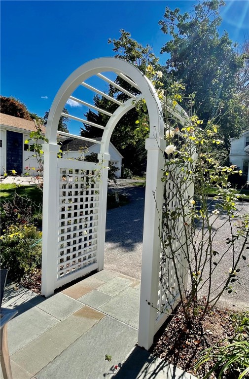 60 Beach Street Westerly, RI 02891 - Photo 30 of 36 Enter your blue stone patio through this picturesque arbor/entry.