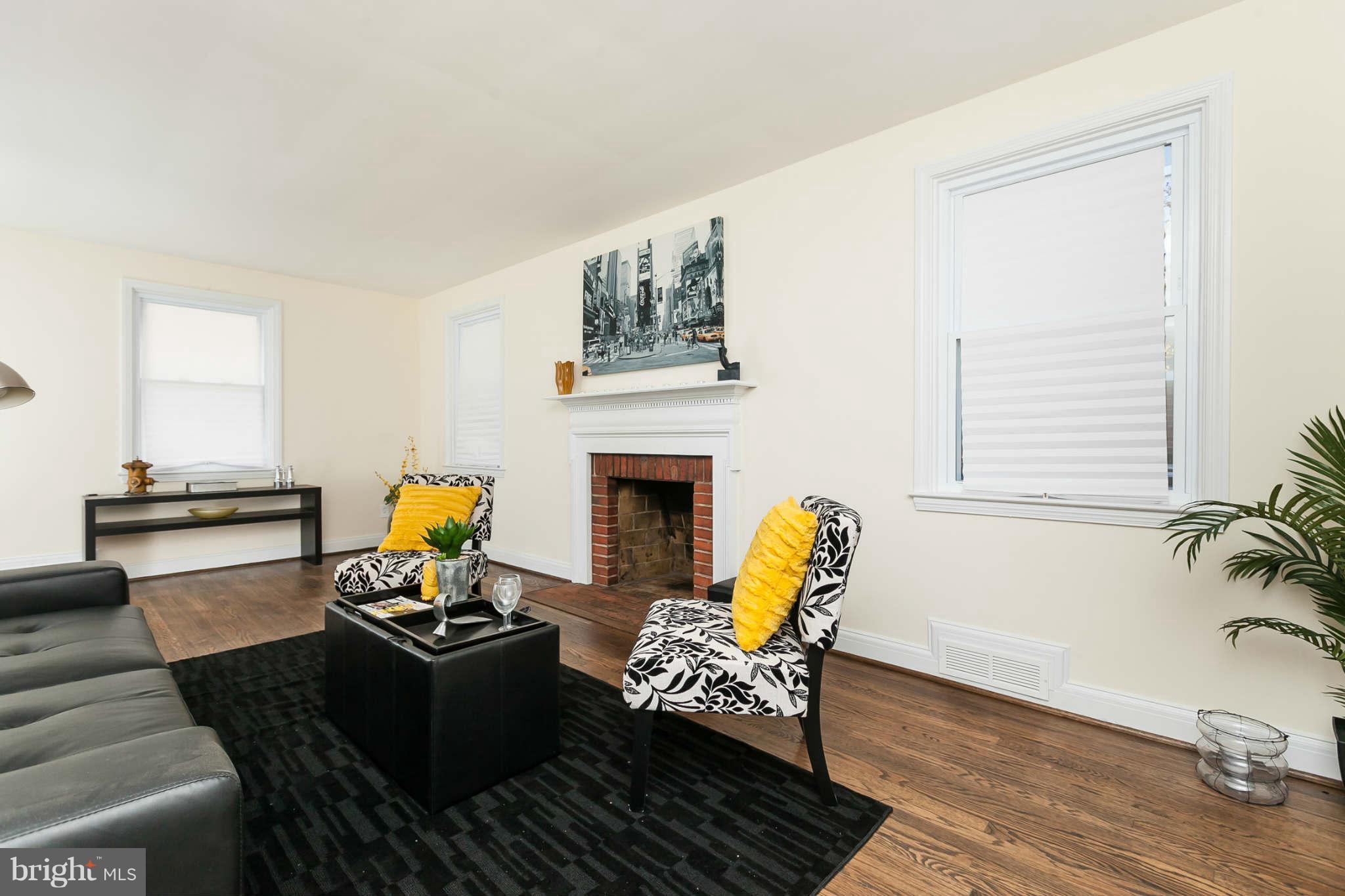 1316 East 35th Street Baltimore, MD 21218 - Photo 12 of 30 a living room with furniture and a fireplace