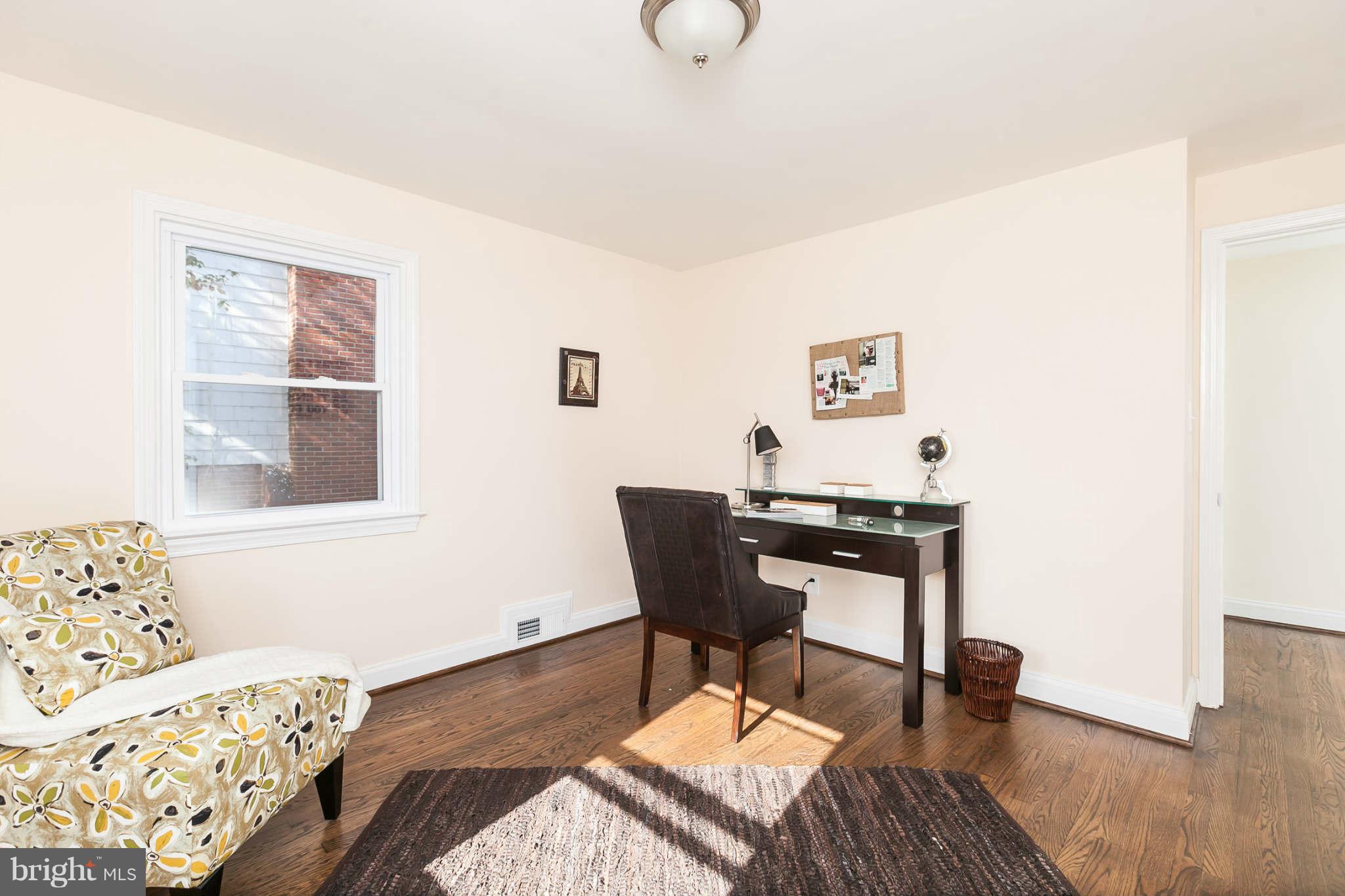 1316 East 35th Street Baltimore, MD 21218 - Photo 19 of 30 a workspace with furniture and window