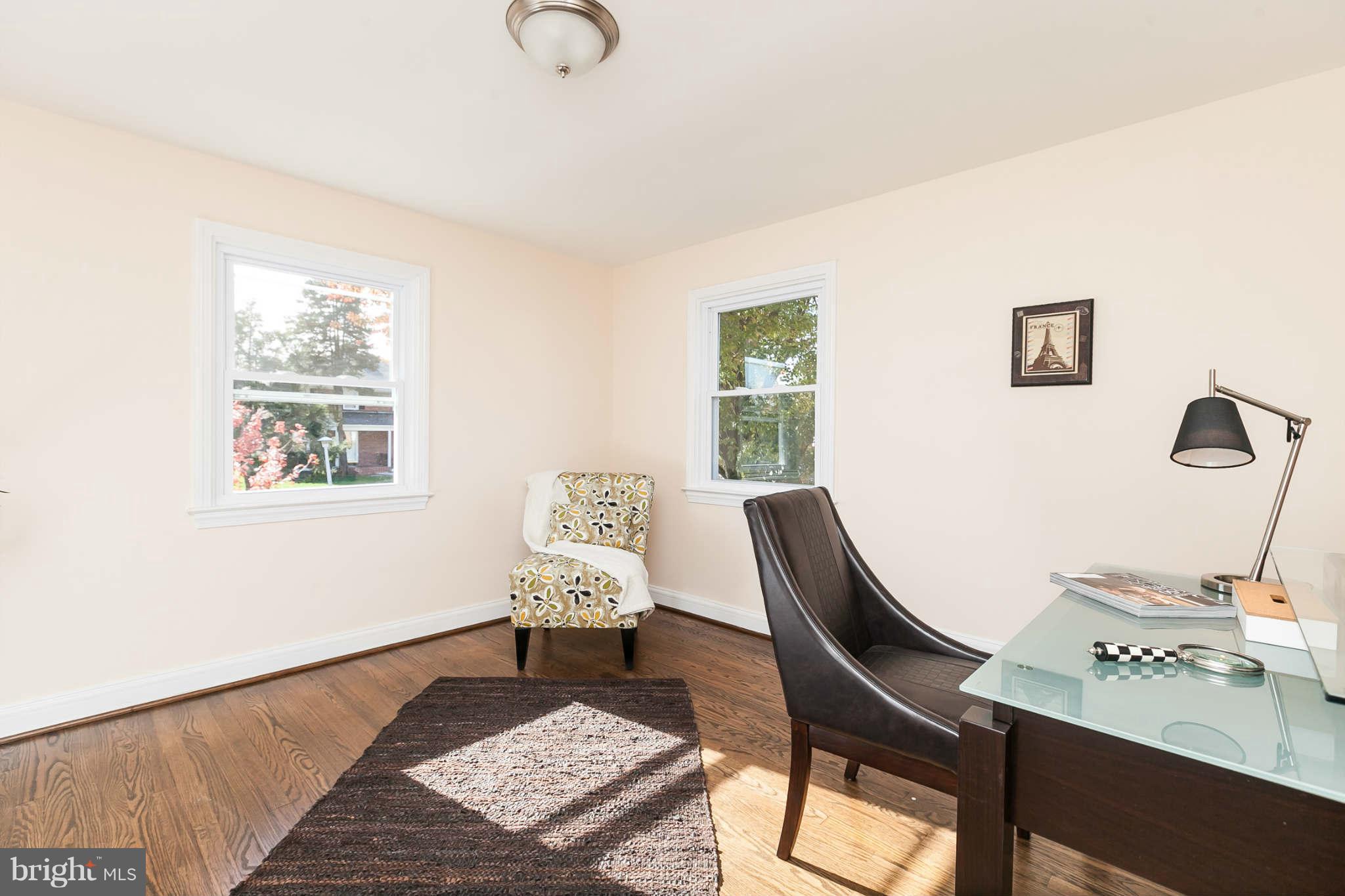1316 East 35th Street Baltimore, MD 21218 - Photo 20 of 30 a living room with furniture and a window