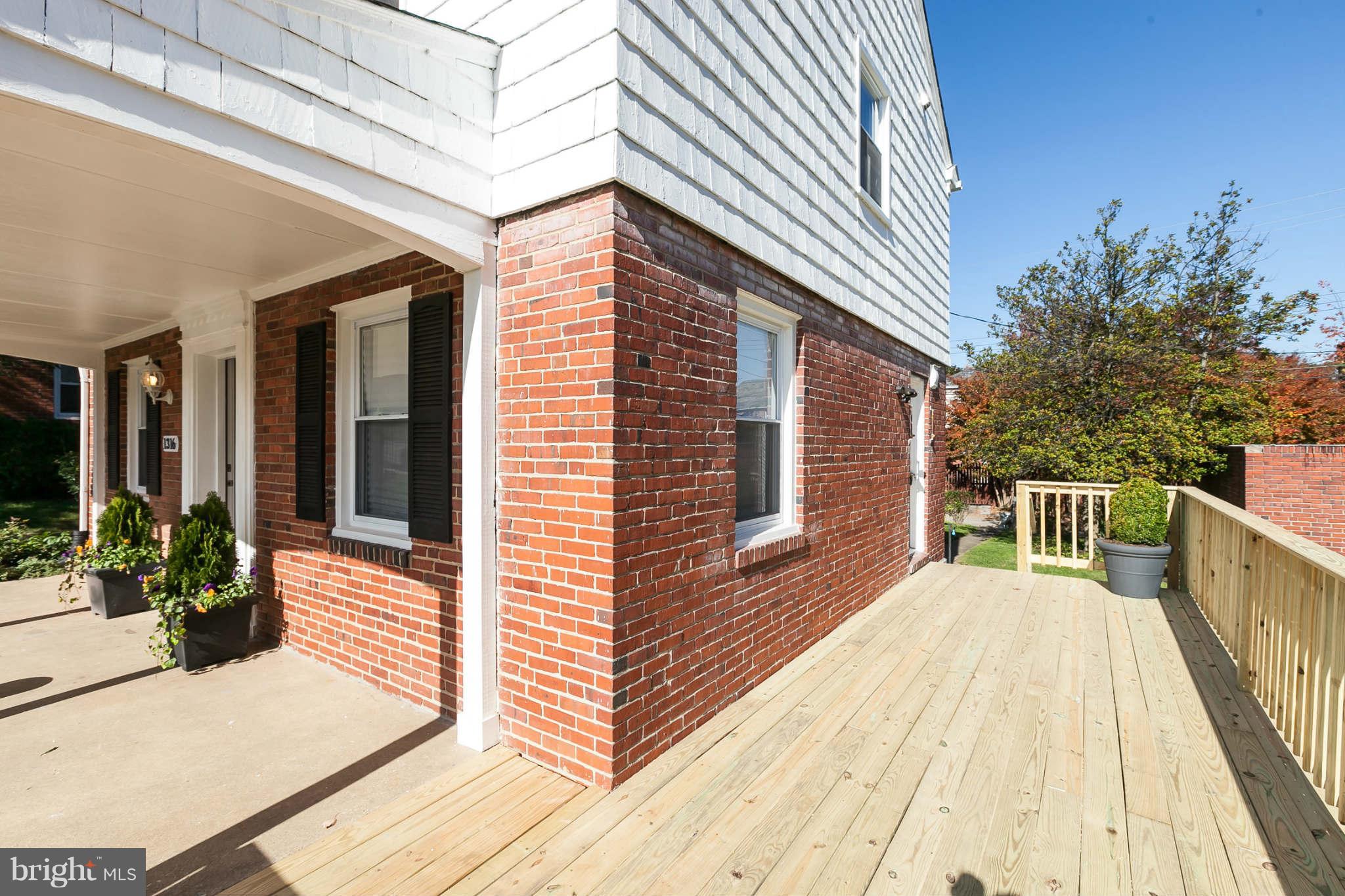 1316 East 35th Street Baltimore, MD 21218 - Photo 3 of 30 a view of a house with backyard and wooden floor