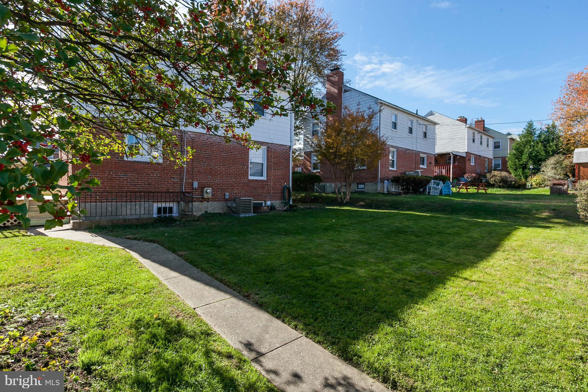 1316 East 35th Street Baltimore, MD 21218 - Photo 28 of 30 a view of a house with a yard