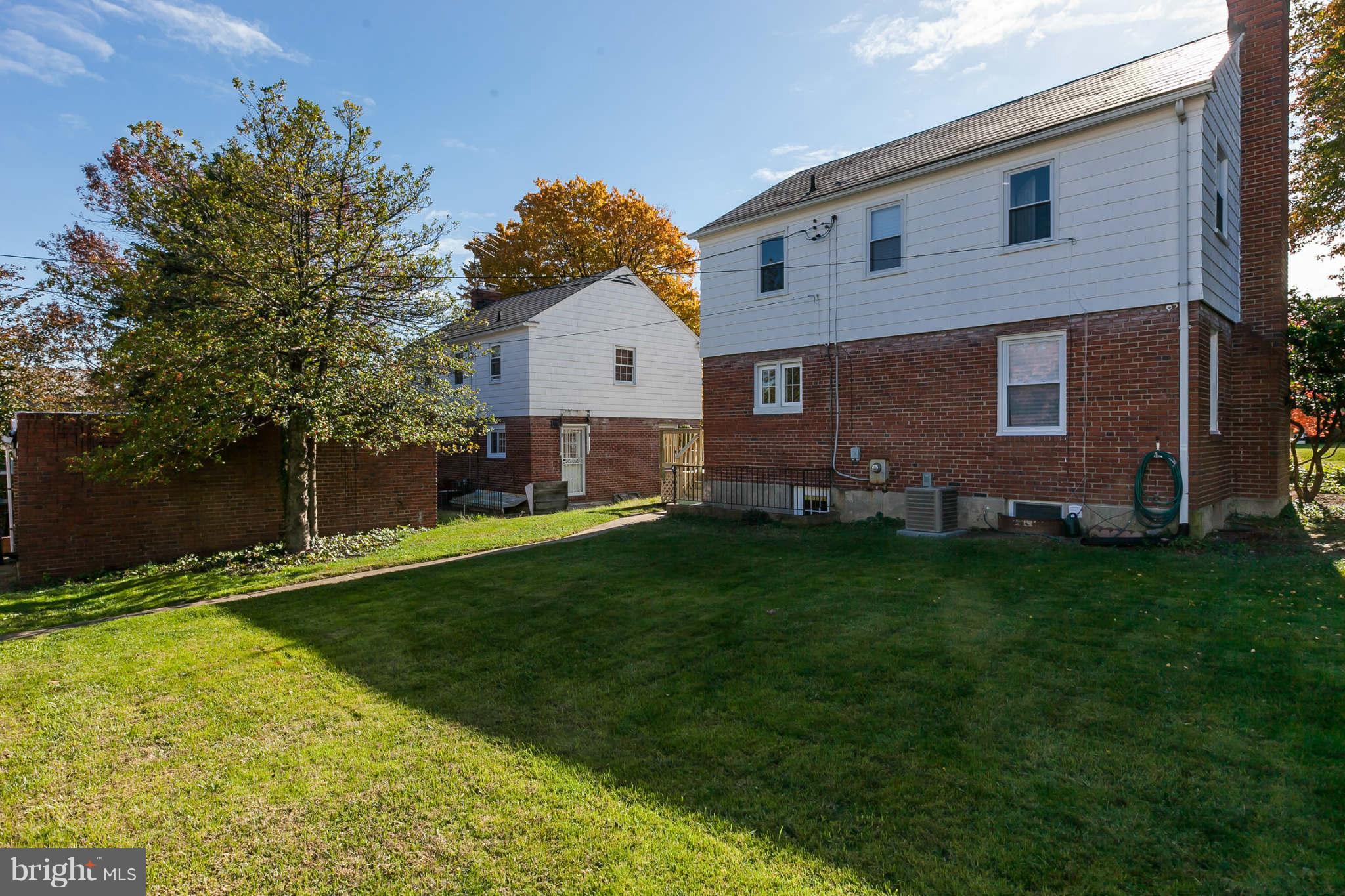 1316 East 35th Street Baltimore, MD 21218 - Photo 30 of 30 a front view of a house with a garden and yard