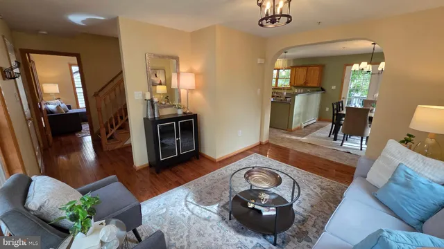 a view of a balcony with wooden floor and outdoor seating