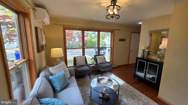 a view of an entryway with dining room and wooden floor