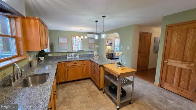 a bedroom with a bed and a lamp with window