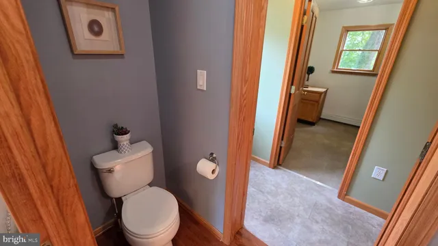 a view of a bathroom from a corridor