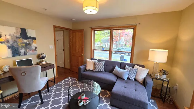 a white toilet sitting next to a bath tub and a shower