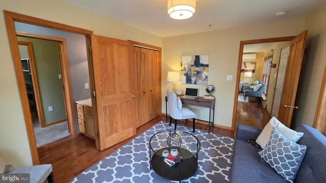 a view of an empty room with gym equipment