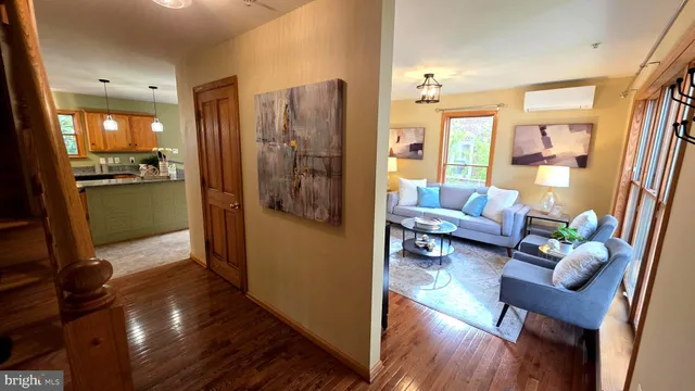 a kitchen with stainless steel appliances granite countertop a sink a stove and a wooden floors