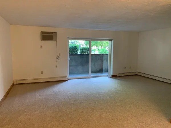wooden floor and window in an empty room
