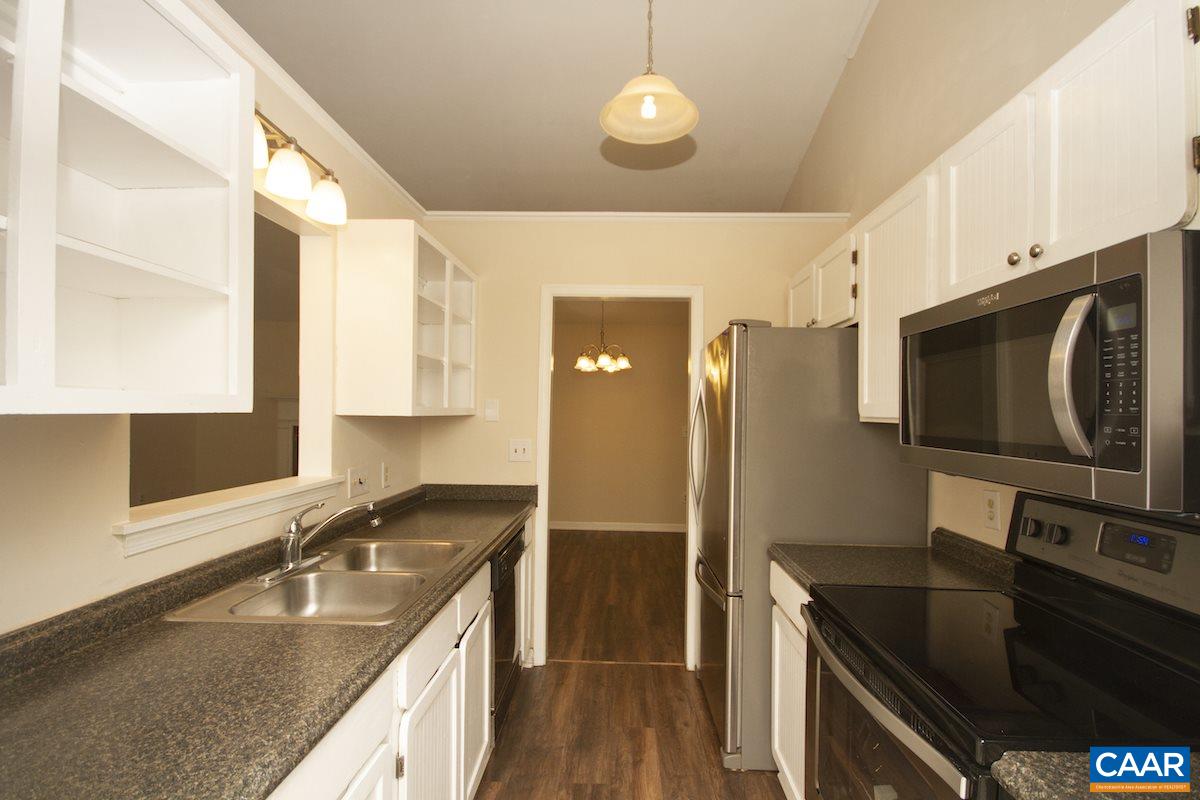 305 Minor Ridge Road Charlottesville, VA 22901 - Photo 8 of 27 a kitchen with granite countertop a sink stove and refrigerator
