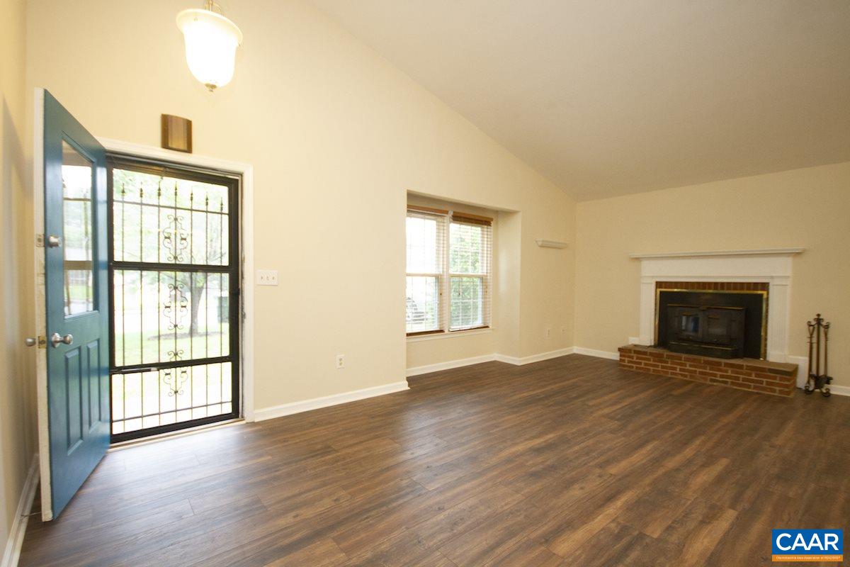 305 Minor Ridge Road Charlottesville, VA 22901 - Photo 10 of 27 wooden floor fireplace and windows in an empty room
