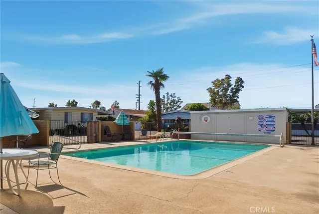 a view of a swimming pool with a chair
