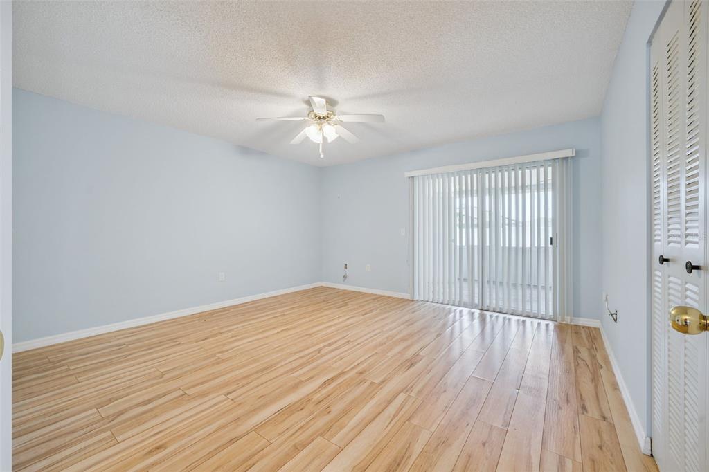 283 Winter Ridge Boulevard, Unit 283 Winter Haven, FL 33881 - Photo 11 of 20 wooden floor in an empty room with a window